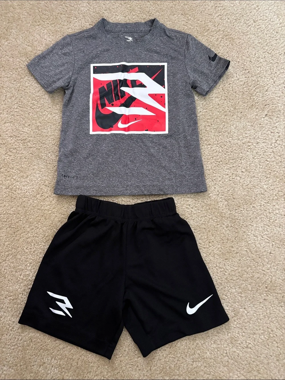 Nike Kids Gray Graphic Tee with Red and Black Logo